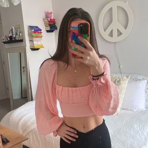 light pink never worn princess polly blouse. great condition. open/tie up back.